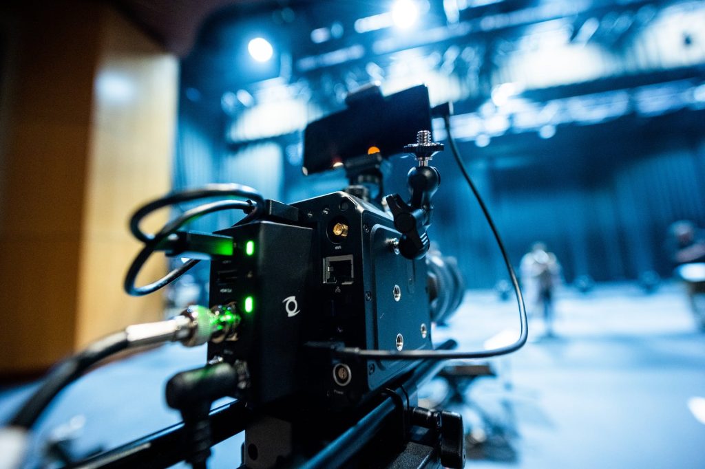 modern digital movie camera in dark room