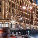 building wrapped with string lights during night time